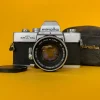 Minolta SRT101b 35mm SLR Film Camera w/ Prime Lens & Original Leather Case