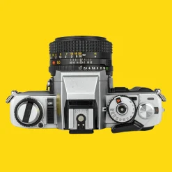 Minolta X-500 SLR 35mm Film Camera with Auto Zoom Lens