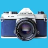 Pentax K1000 Navy Leather Vintage SLR 35mm Film Camera with Pentax f/2 50mm Prime Lens.