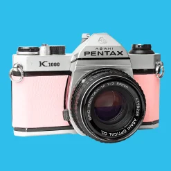 Pentax K1000 Pink Leather Vintage SLR 35mm Film Camera with Pentax f/2 50mm Prime Lens.